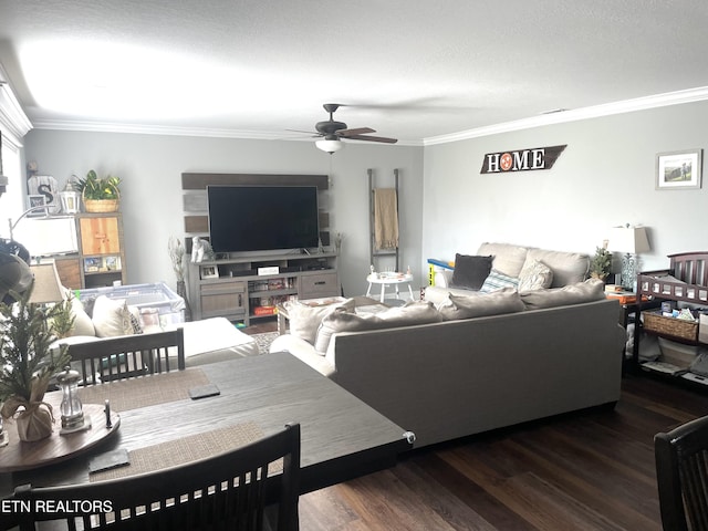 living room featuring dark wood-type flooring, ceiling fan, and ornamental molding