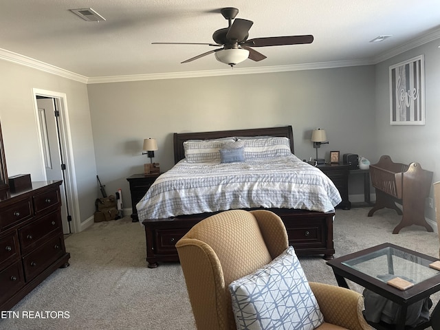 bedroom featuring crown molding, light colored carpet, and ceiling fan