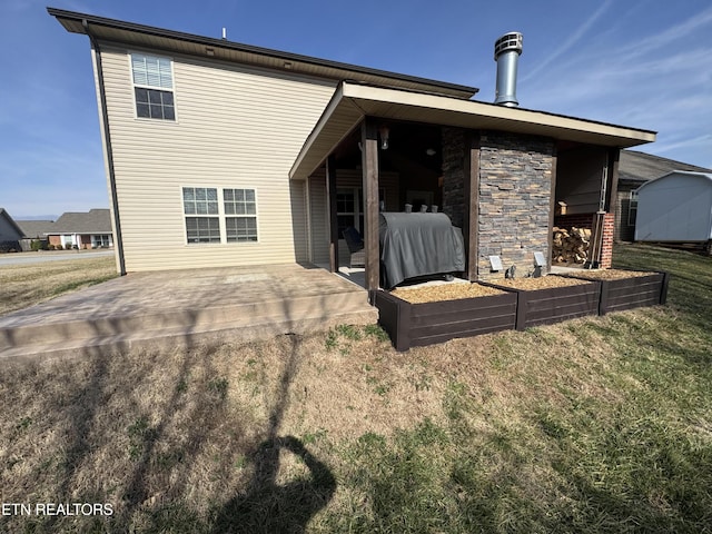 back of property featuring a patio