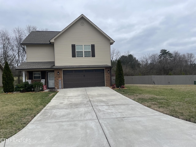 front of property with a garage and a front lawn