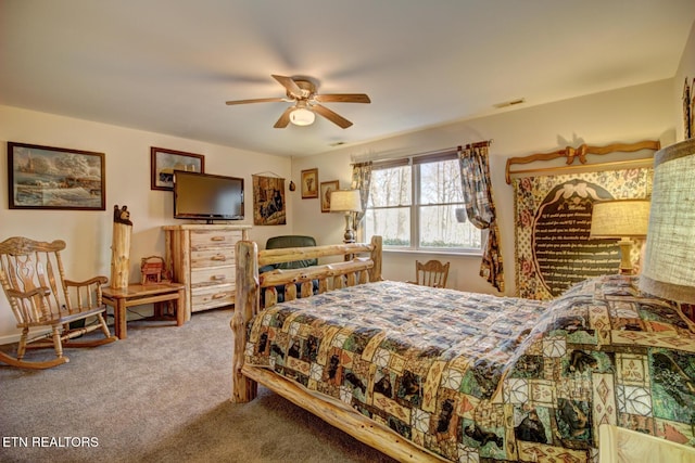 bedroom with ceiling fan and carpet