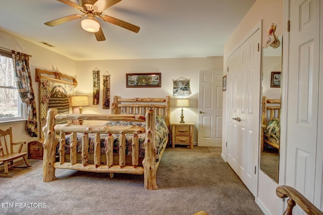 carpeted bedroom featuring ceiling fan