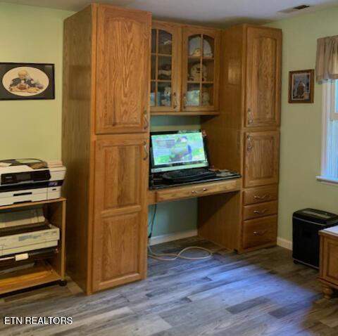 unfurnished office with light wood-type flooring