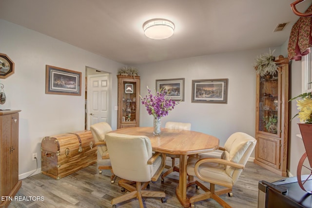 dining room with light hardwood / wood-style floors