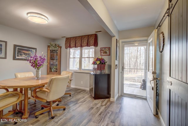 dining area with light hardwood / wood-style floors