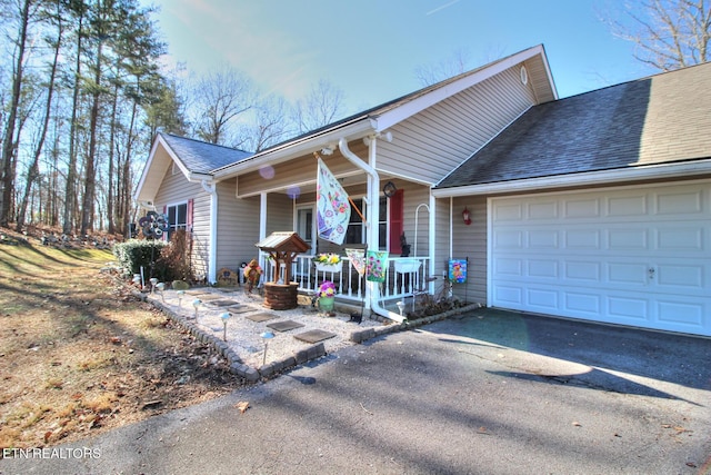 view of front of house featuring a garage and a porch