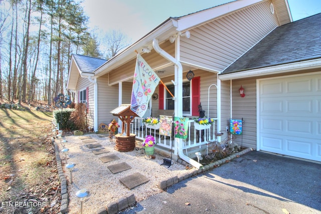 view of front of property with a garage and a porch