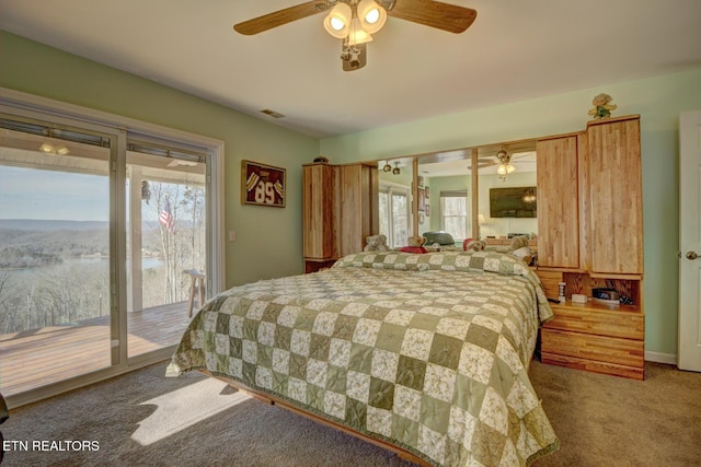 carpeted bedroom with ceiling fan and access to exterior