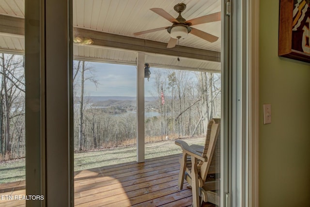 sunroom / solarium featuring wood ceiling and ceiling fan