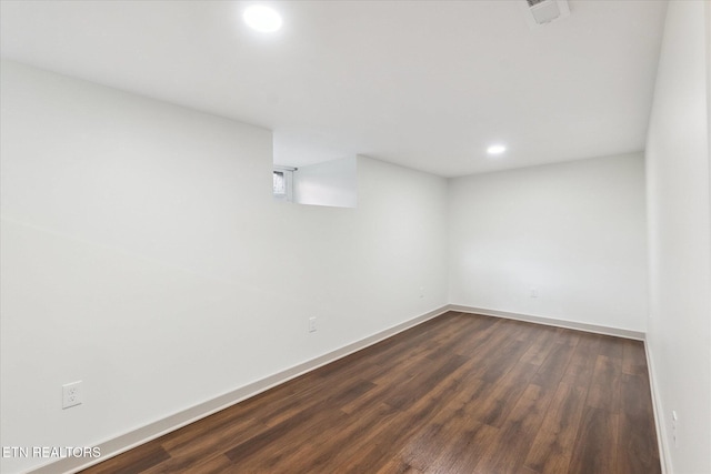 basement featuring dark hardwood / wood-style floors