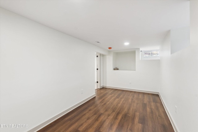 unfurnished room featuring dark hardwood / wood-style floors