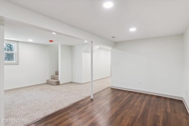 basement featuring dark hardwood / wood-style floors