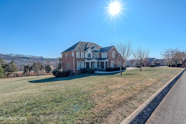 front facade with a front yard