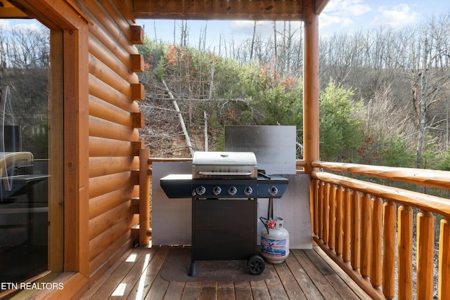 wooden terrace featuring grilling area