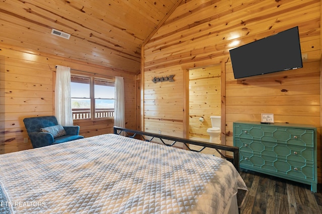 bedroom featuring vaulted ceiling, connected bathroom, wood walls, dark hardwood / wood-style flooring, and wood ceiling