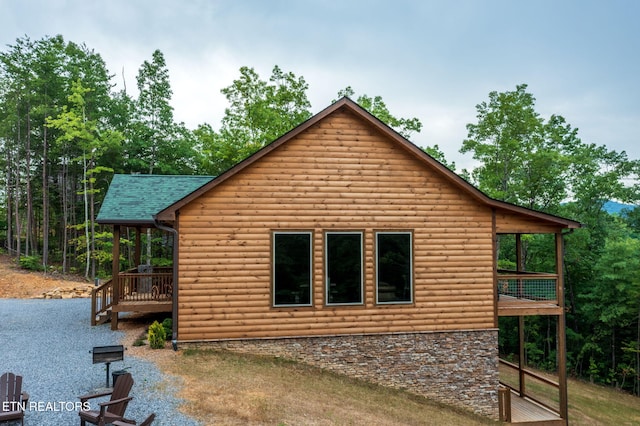 view of home's exterior with a deck