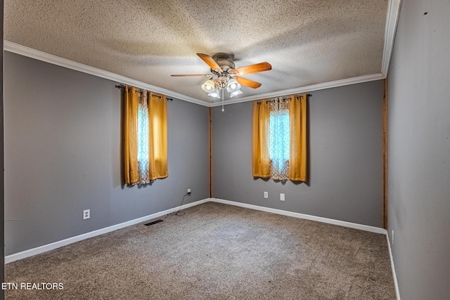 carpeted spare room featuring ornamental molding, ceiling fan, and a textured ceiling