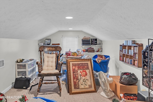 bonus room with vaulted ceiling, carpet flooring, and a textured ceiling