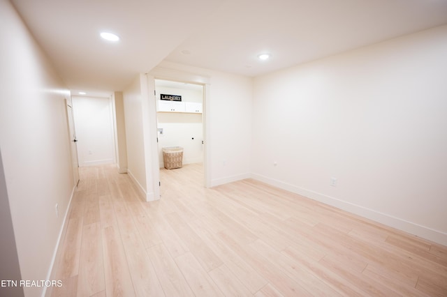 spare room featuring light hardwood / wood-style flooring