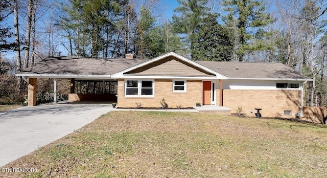 ranch-style home with a carport and a front lawn