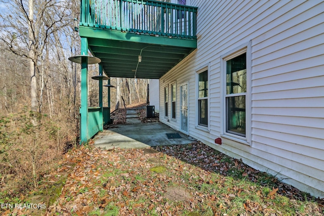 view of home's exterior with cooling unit and a patio area