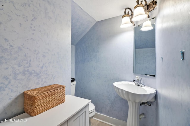 bathroom featuring tile patterned flooring and toilet