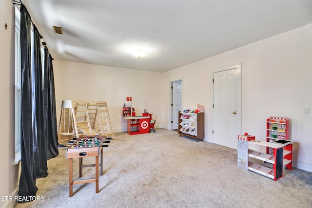 recreation room featuring carpet flooring