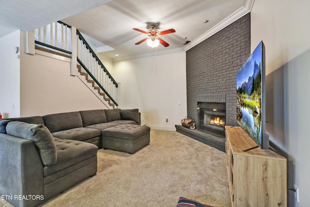 carpeted living room featuring crown molding, a brick fireplace, and ceiling fan