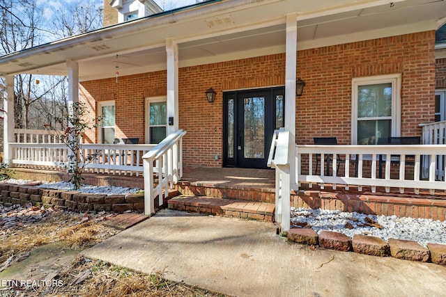 doorway to property with a porch