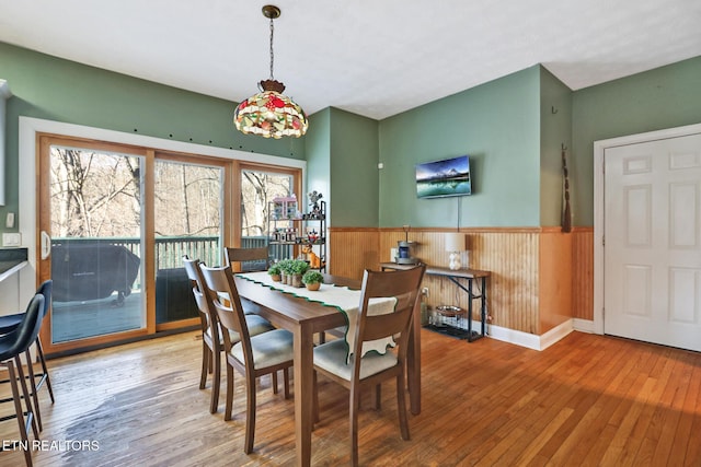 dining area with hardwood / wood-style flooring