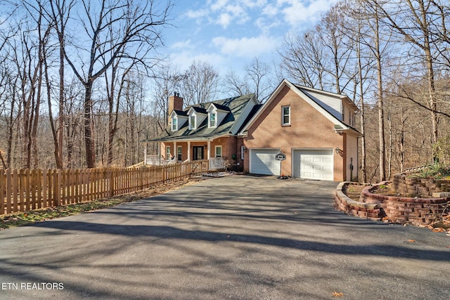 view of front of house featuring a garage and covered porch