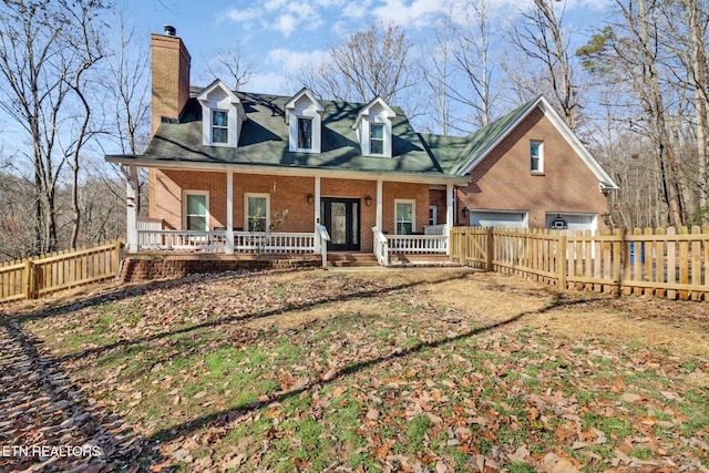 view of front of house featuring a porch and a garage