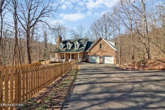 new england style home with covered porch