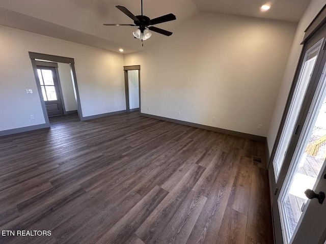 empty room with ceiling fan, dark hardwood / wood-style flooring, and high vaulted ceiling