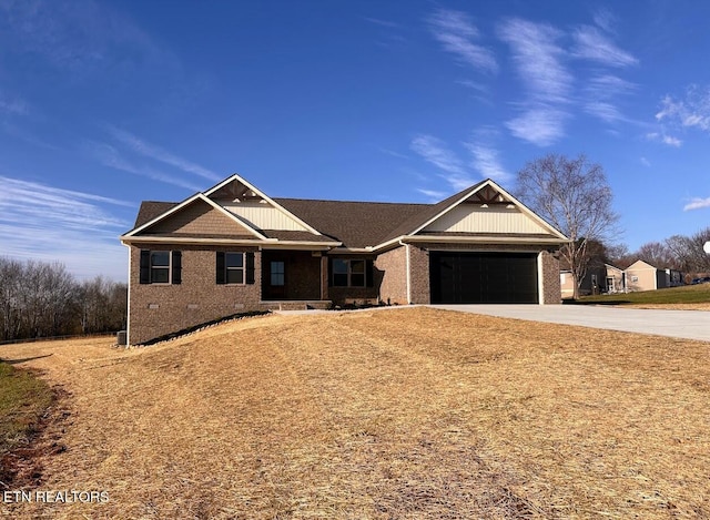 view of front of home featuring a garage, driveway, brick siding, and crawl space