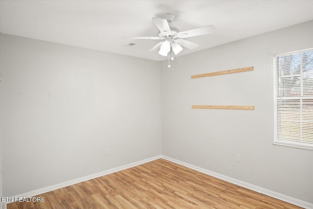 unfurnished room featuring ceiling fan and light hardwood / wood-style floors