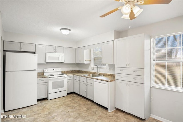 kitchen featuring sink, white cabinetry, white appliances, a textured ceiling, and ceiling fan