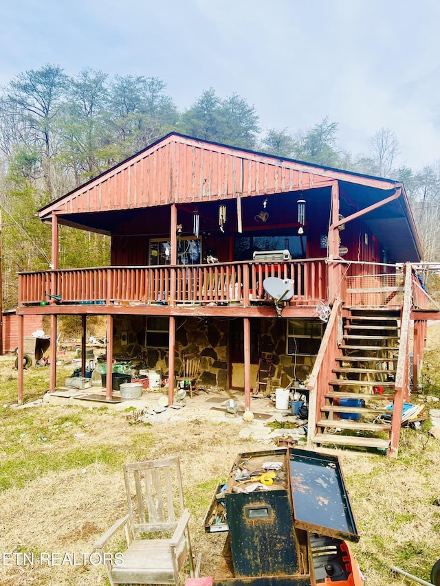 back of property featuring a deck