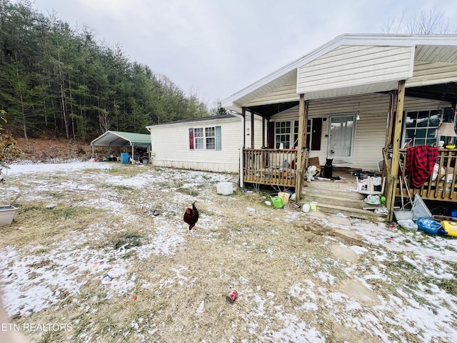 exterior space featuring a carport and a deck