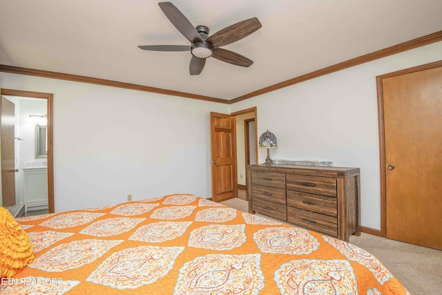 bedroom with crown molding, ceiling fan, ensuite bathroom, and light carpet