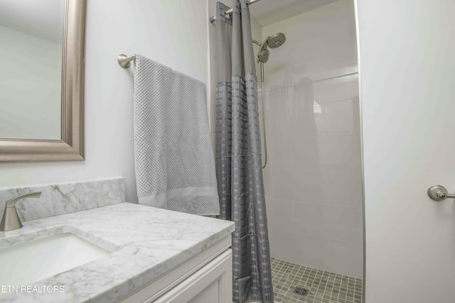 bathroom with vanity and a shower with shower curtain