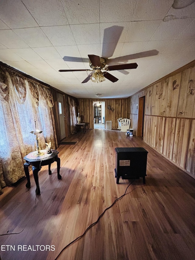 interior space featuring hardwood / wood-style flooring and ceiling fan