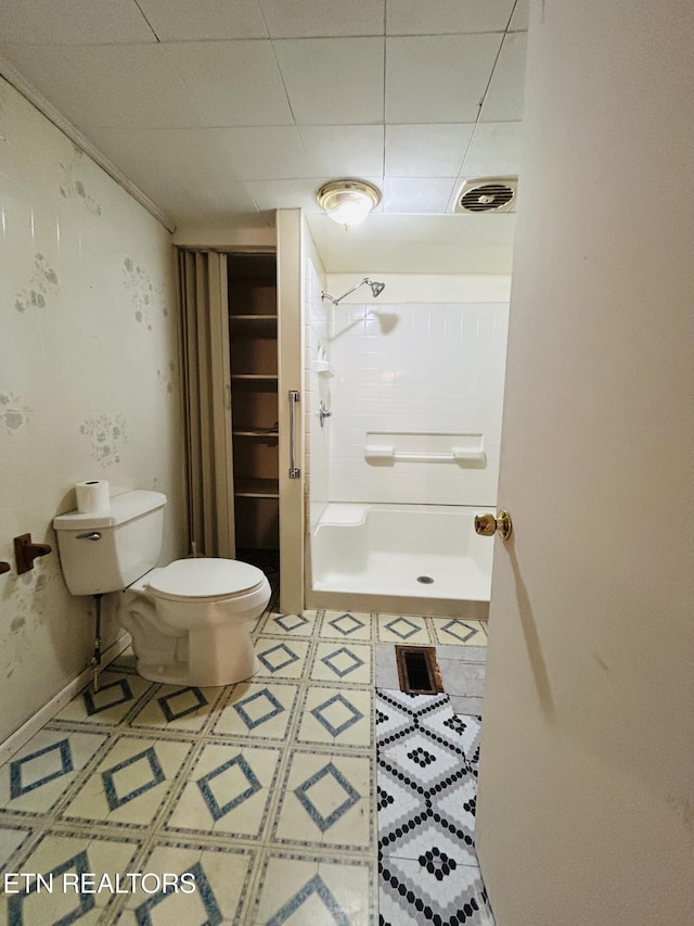 bathroom with toilet and walk in shower