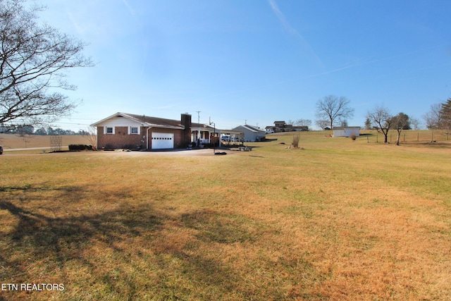 view of yard featuring a garage