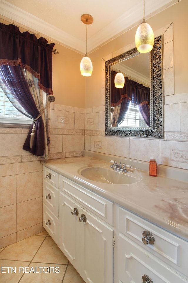 bathroom with ornamental molding, tile walls, vanity, and tile patterned floors