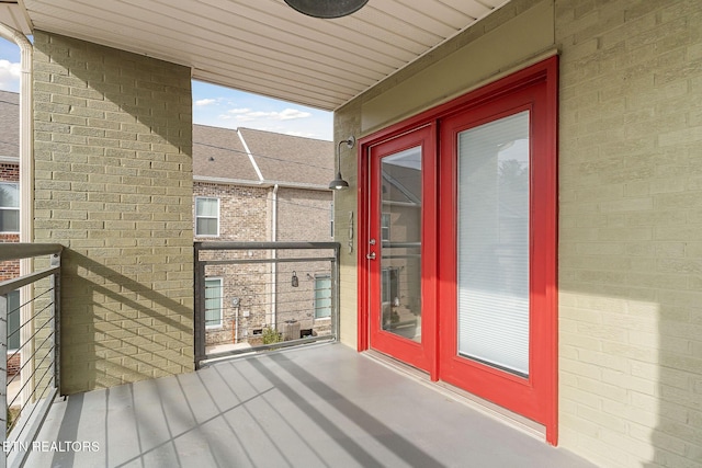 entrance to property featuring a balcony