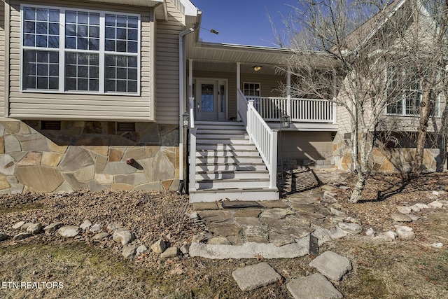 property entrance with covered porch