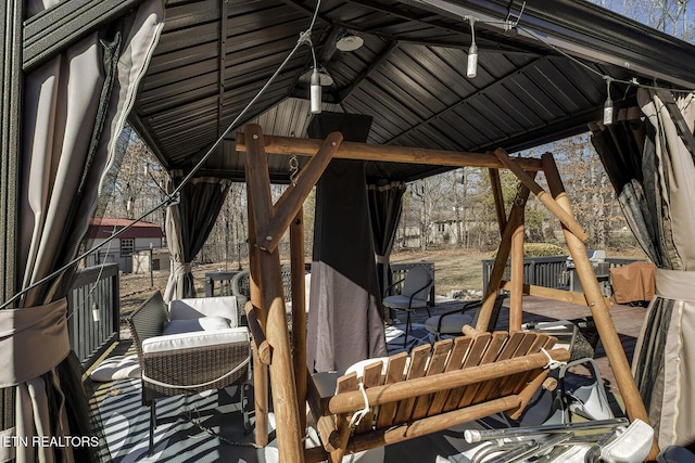 view of patio / terrace with an outdoor living space and a gazebo