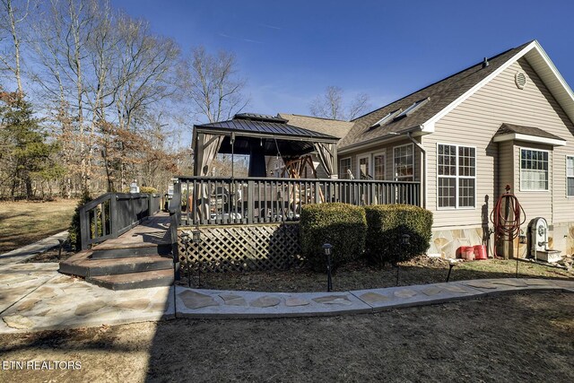 view of front of home with a gazebo and a deck