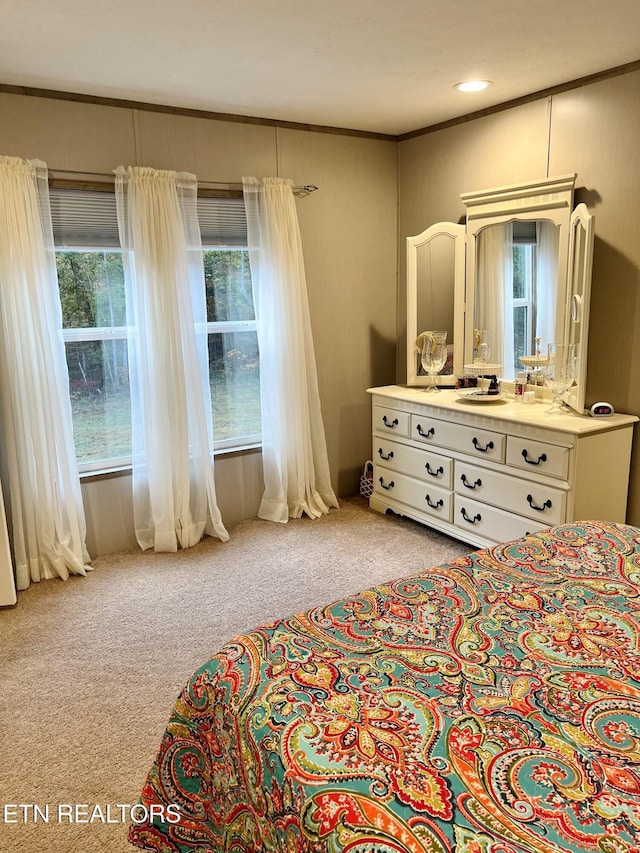 carpeted bedroom featuring ornamental molding